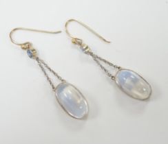 A pair of yellow metal, oval cabochon moonstone and round cut sapphire set drop earrings, 30mm,