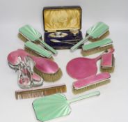 A 1930's five piece silver and green enamel mounted mirror and brush set by Mappin & Webb, a 1920'