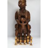 A Nigerian figural wood carving of ‘Imota’ mother and child, 67cm high and a large collection of