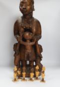A Nigerian figural wood carving of ‘Imota’ mother and child, 67cm high and a large collection of