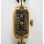 A lady's 1930's 18ct gold Eterna manual wind wrist watch, on a twin strand fabric strap with gold
