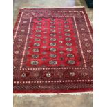 A Bokhara red ground carpet, 290 x 230cm