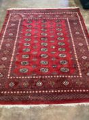 A Bokhara red ground carpet, 290 x 230cm