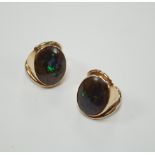 A pair of yellow metal and oval boulder opal set dress rings, both size M, gross weight 20 grams.