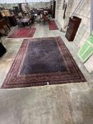A North West Persian blue ground carpet, 390 x 318cm