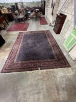 A North West Persian blue ground carpet, 390 x 318cm