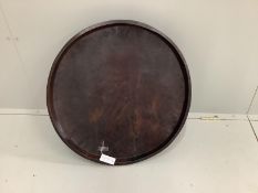An African circular carved hardwood tray, diameter 66cm, height 10cm