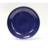 A Chinese blue glazed dish, Yongzheng mark but later, 22.5cm diameter