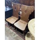 A pair of oak hall chairs, width 44cm, depth 41cm, height 105cm