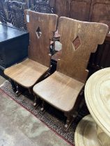 A pair of oak hall chairs, width 44cm, depth 41cm, height 105cm