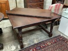A continental mahogany extending dining table, approx. 180cm extended, width 122cm, height 70cm