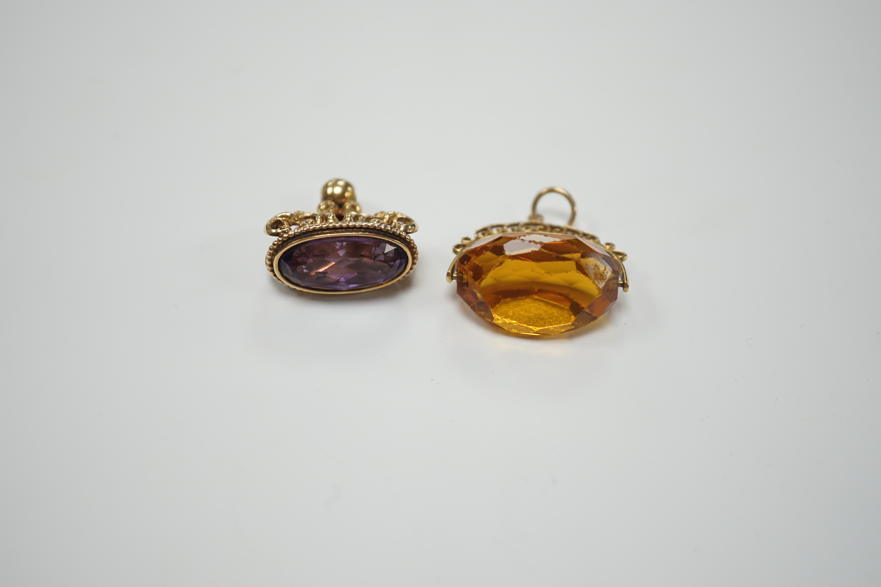 A yellow metal and amethyst set spinning fob, 22mm and one other 9ct gold and gem set fob, gross - Image 3 of 4