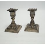 A pair of late Victorian wrythened silver mounted dwarf candlesticks, Hawksworth, Eyre & Co Ltd,