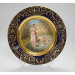 An early 20th century Vienna style cabinet plate inscribed verso, Kneippkur !, 24cm diameter