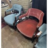 A pair of late Victorian tub shaped open armchairs, upholstered, one in red, the other in blue,