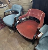 A pair of late Victorian tub shaped open armchairs, upholstered, one in red, the other in blue,