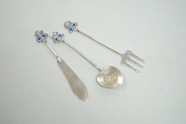 An Edwardian Art Nouveau silver and enamel, butter knife, pickle fork and small server, by Daniel
