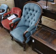 A late Victorian mahogany framed button back armchair, on cabriole legs, width 68cm, depth 72cm,
