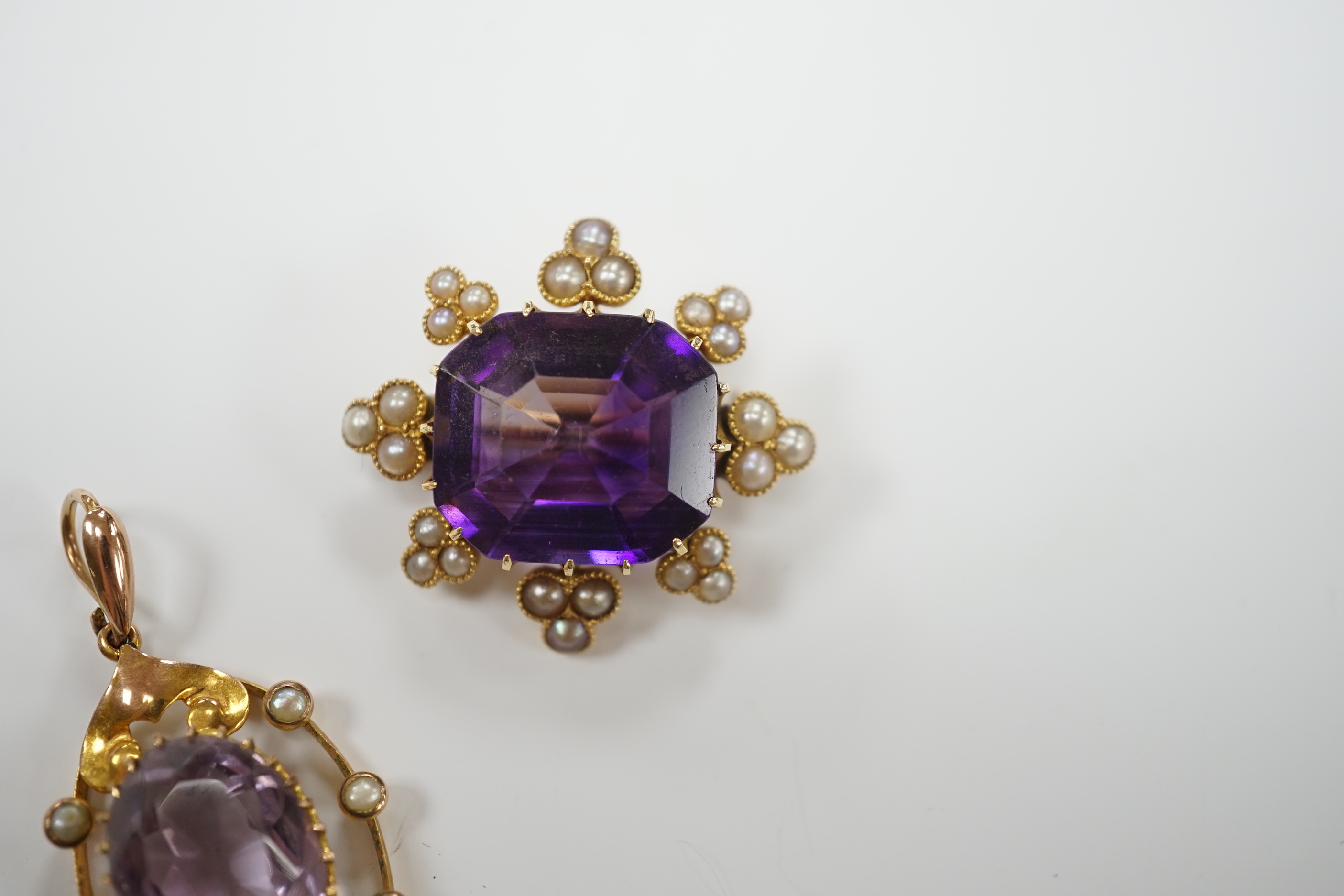 An early 20th century yellow metal, amethyst and seed pearl set brooch, 26mm and a similar - Image 2 of 6