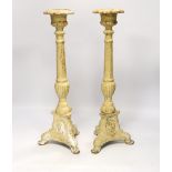 A pair of period-style cast iron candlesticks, 43cm