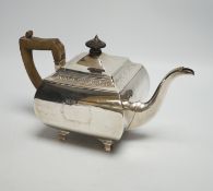 A George III silver shaped square teapot, by Urquhart & Hart, London, 1805, on bracket feet, gross