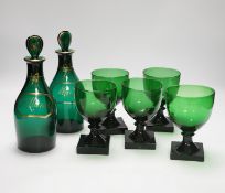 A pair of small Bristol green decanters, Rum and Hollands, c.1800 and five 19th century green