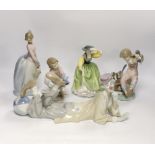 A Lladro recumbent clown, three smaller Lladro figures and a Royal Doulton Buttercup figure, clown