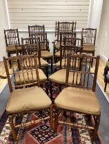 A Harlequin set of twelve 19th century Lancashire ash elm and beech rush seat spindle back chairs