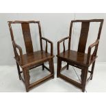 A pair of Chinese hardwood elbow chairs, width 56cm, depth 44cm, height 107cm