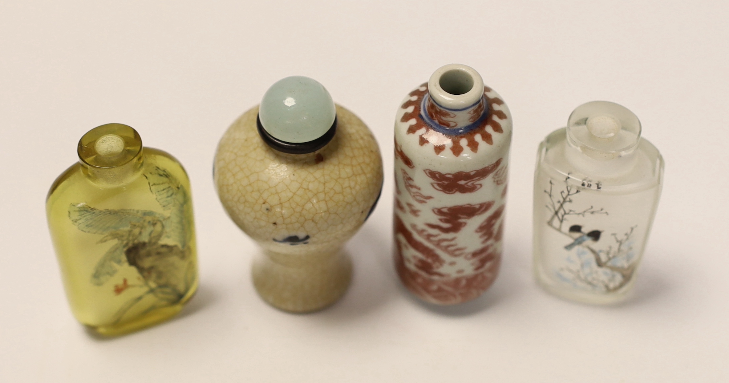 A Chinese crackle glaze snuff bottle, two inside painted glass snuff bottles and an underglaze - Image 3 of 4