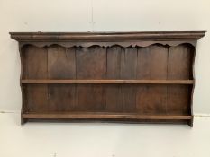 An 18th century boarded oak plate rack, width 163cm, height 82cm