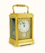 An early 20th century French ormolu Grande Sonnerie alarum clock, with enamelled Arabic dials and