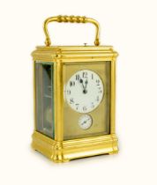 An early 20th century French ormolu Grande Sonnerie alarum clock, with enamelled Arabic dials and