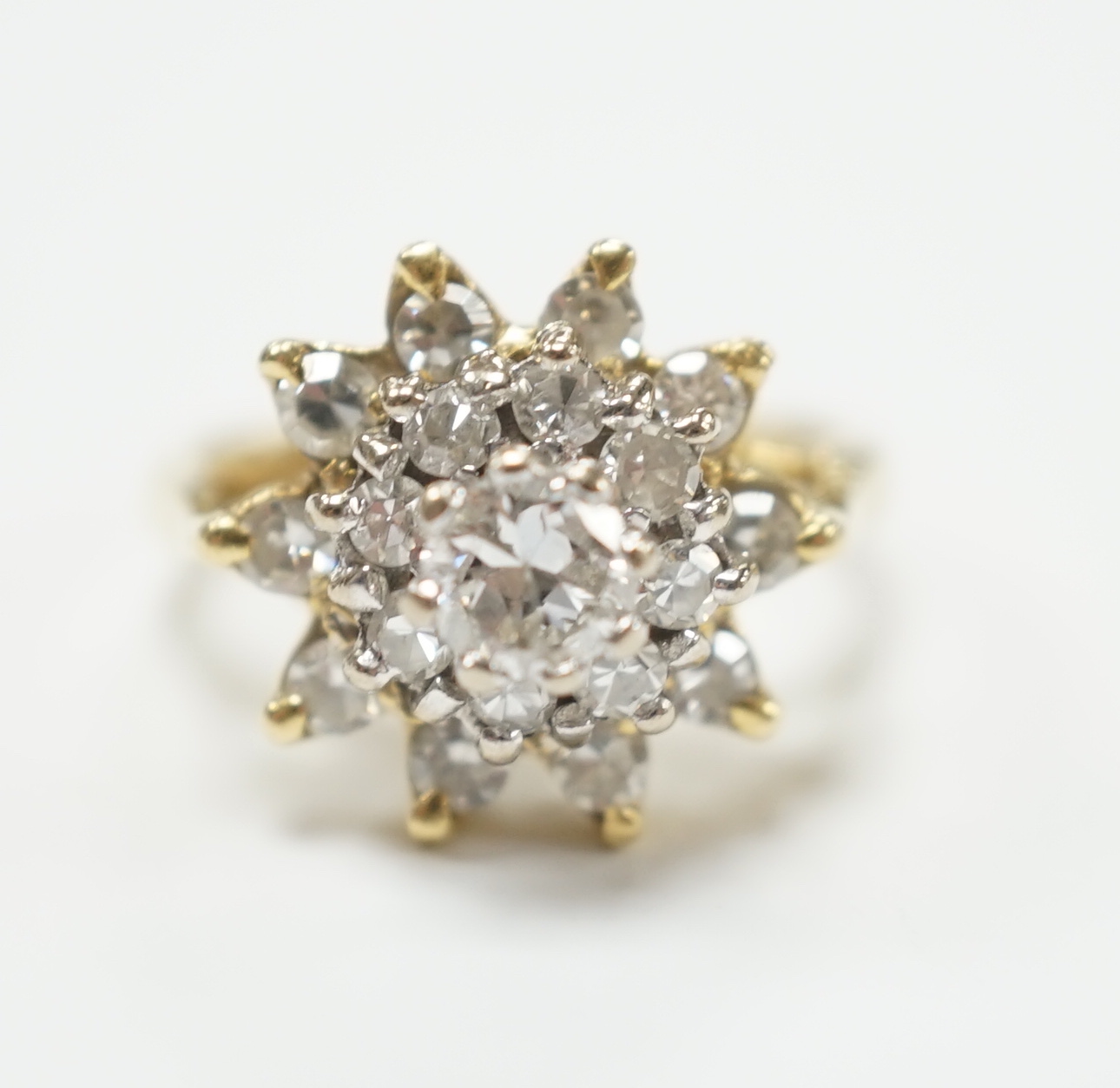 An 18ct and diamond cluster set dress ring, size I, gross weight 5.8 grams,