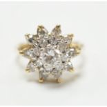 An 18ct and diamond cluster set dress ring, size I, gross weight 5.8 grams,