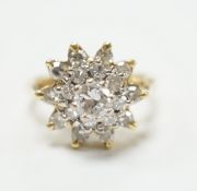 An 18ct and diamond cluster set dress ring, size I, gross weight 5.8 grams,