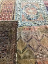 Four antique North West Persian and Caucasian rugs, largest 180 x 142cm