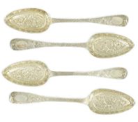 A cased set of four late George III embossed and engraved parcel gilt silver Hanovarian pattern