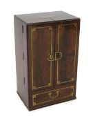 A Regency brass inset mahogany apothecary chest with two doors, enclosing a compartmented interior