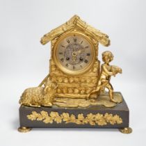 A 19th century ormolu clock, Richard & Cie stamped movement, case formed as a log cabin with child