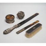 A late Victorian silver handled tortoiseshell page turner, a small page turner, a silver and