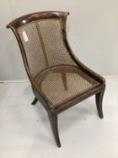 A Regency simulated rosewood bergere chair, width 49cm, depth 48cm, height 83cm