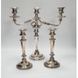 A Sheffield plate two branch, three light candelabra and a pair of candlesticks, candelabra 36cm