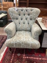 A modern upholstered armchair, width 92cm, depth 70cm, height 110cm