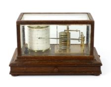 A barograph by Dollond in an oak case with bevelled glass panels and incorporating an ink bottle and