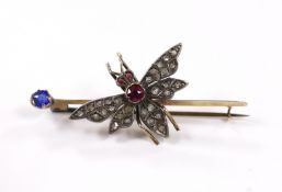 A Victorian yellow metal, rose cut diamond, ruby and blue stone doublet set bug bar brooch, 54mm,
