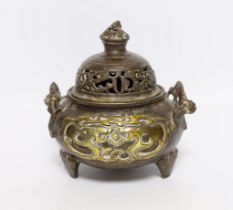 A Chinese parcel gilt bronze censer, with pierced lid and twin zoomorphic handles, 15cm high