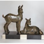An Art Deco patinated spelter twin goat group on marble base, etched ‘Rochard’ on base, 36cm high