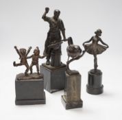 A German bronze of a blacksmith, indistinctly signed, a bronze figure group signed Öbold, a bronze