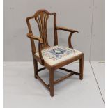 A George III provincial elm elbow chair, width 58cm, depth 45cm, height 94cm